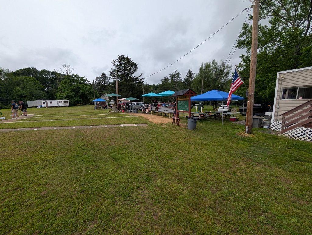Clubhouse, canopies and picnic tables on a practice day